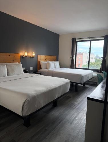 Habitación con 2 camas grandes del hotel Bklyn House. Foto 5