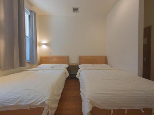 Habitación Cuádruple Deluxe con baño privado del hotel U.s. Pacific. Foto 1