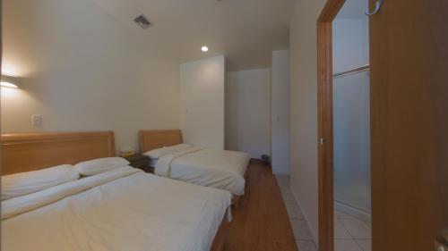 Habitación Cuádruple Deluxe con baño privado del hotel U.s. Pacific. Foto 2