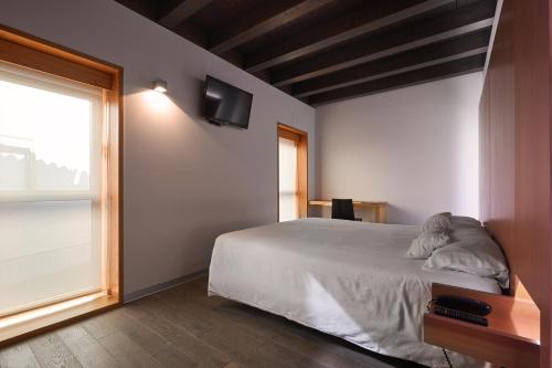 Habitación Doble Estándar - 1 o 2 camas del hotel María Pacheco Hotel Boutique. Foto 10