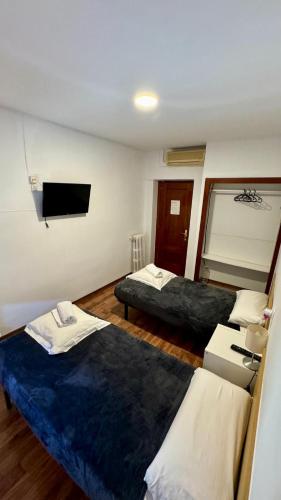 Habitación Doble con baño compartido - 2 camas del hotel H Metropolitan Atocha. Foto 8