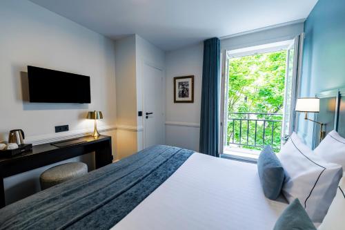 Habitación Doble Clásica del hotel Le Cercle Tour Eiffel. Foto 3