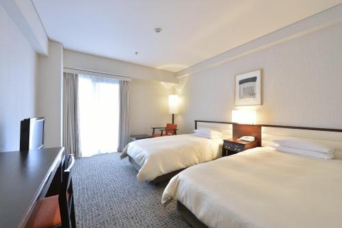 Habitación Estándar con 2 camas individuales y acceso al centro de fitness - Para no fumadores del hotel Kyoto Tokyu. Foto 1