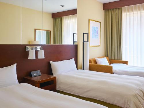 Habitación con 2 camas individuales - Ala sur - No fumadores del hotel Miyako Kyoto Hachijo. Foto 8