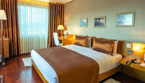 Habitación Individual Deluxe del hotel Tirana International and Conference Centre. Foto 6