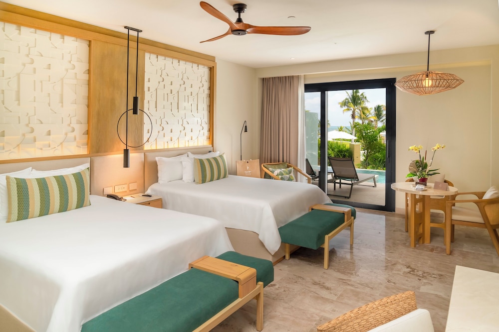 Serenity Club Junior Suite Swim Out Vista Parcial al Mar 2 Camas Queen del hotel Haven Riviera Cancun - All Inclusive - Adults Only. Foto 3