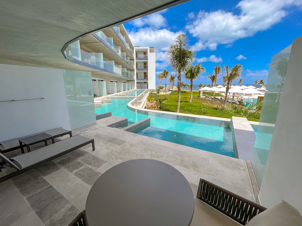Serenity Club Junior Suite Swim Out Vista Parcial al Mar 2 Camas Queen del hotel Haven Riviera Cancun - All Inclusive - Adults Only. Foto 5