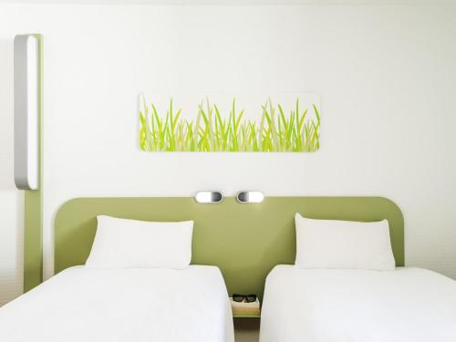 Habitación Doble Estándar - 2 camas del hotel Ibis Budget Stuttgart City Nord. Foto 3