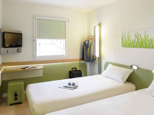Habitación Doble - 2 camas del hotel Ibis Budget Albi Terssac. Foto 7