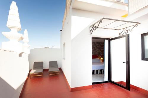 Habitación Doble con terraza del hotel Petit Palace Puerta de Triana. Foto 11