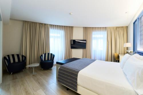 Habitación Deluxe del hotel Catalonia Porto. Foto 3