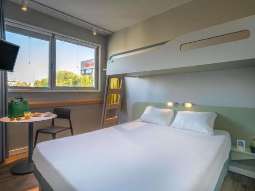Habitación Doble Superior con litera del hotel Ibis Budget Barcelona Viladecans. Foto 4