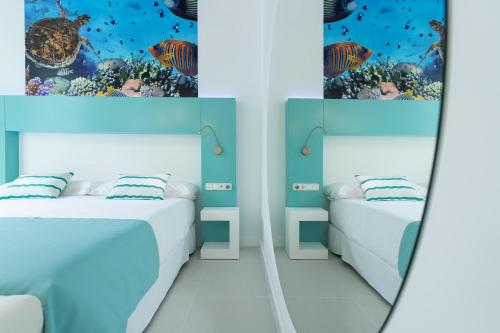 Suite Vista Jardin Vista ciudad Sofá Cama incluido 1 Cama doble del hotel Hd Acuario Lifestyle. Foto 1