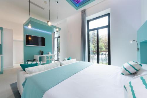 Suite Vista Jardin Vista ciudad Sofá Cama incluido 1 Cama doble del hotel Hd Acuario Lifestyle. Foto 2