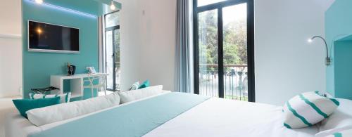 Suite Vista Jardin Vista ciudad Sofá Cama incluido 1 Cama doble del hotel Hd Acuario Lifestyle. Foto 3