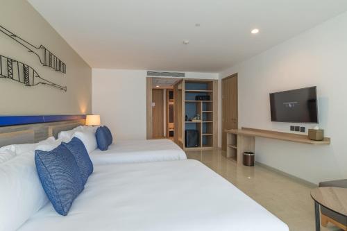 Habitación Deluxe Prémium con 2 camas dobles del hotel Centara Ao Nang Beach Resort and Spa Krabi. Foto 1