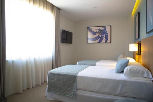 Habitación Deluxe Twin - 2 camas individuales del hotel RIU Plaza España. Foto 2