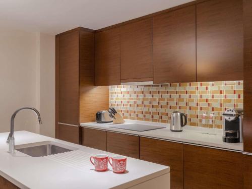 One - Bedroom Premium Apartment with Burj Khalifa and Creek View del hotel Swissotel Living Al Ghurair. Foto 4