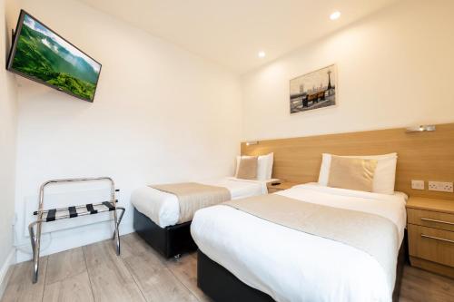 Estudio con 2 camas individuales del hotel NOX HOTELS - Kensington. Foto 2