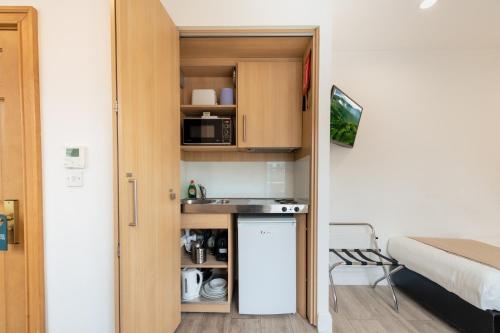 Estudio con 2 camas individuales del hotel NOX HOTELS - Kensington. Foto 8