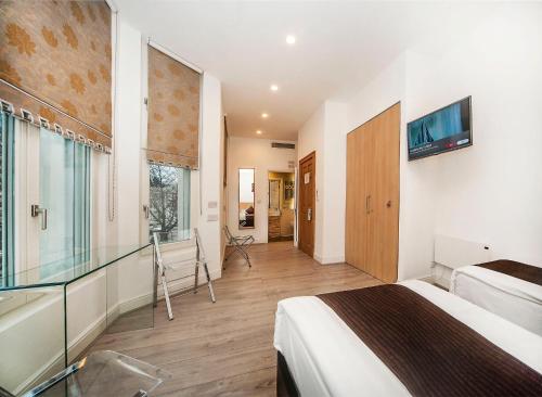 Estudio con 2 camas individuales del hotel NOX HOTELS - Kensington. Foto 12