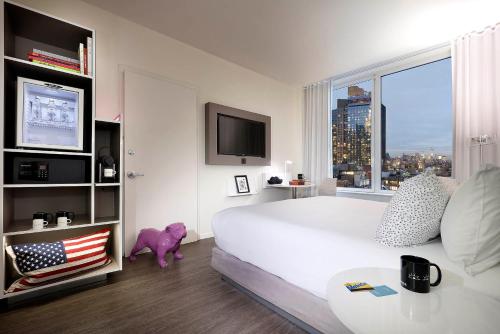 Loft The Family con vistas a la ciudad del hotel Innside New York NoMad. Foto 1