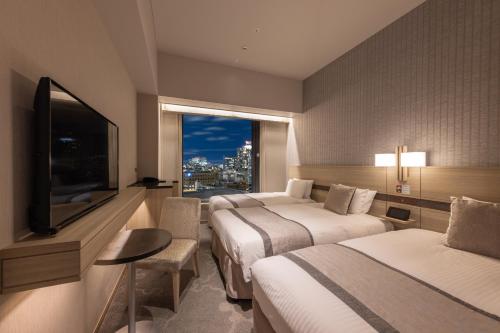 Habitación Doble Estándar con cama supletoria - 2 camas individuales - Planta Superior - No fumadores del hotel KEIHAN TSUKIJI GINZA GRANDE