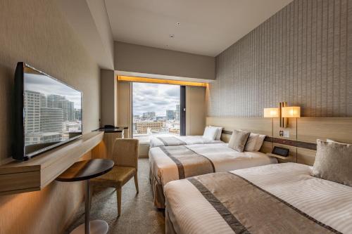 Habitación Doble Estándar con cama supletoria - 2 camas individuales - Planta Superior - No fumadores del hotel KEIHAN TSUKIJI GINZA GRANDE. Foto 1
