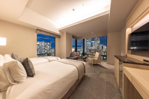 Habitación Doble Deluxe para no fumadores en planta superior - 2 camas del hotel KEIHAN TSUKIJI GINZA GRANDE. Foto 1