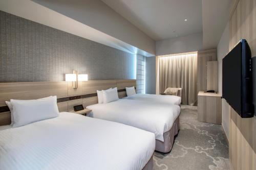 Habitación Doble Confort con cama supletoria - 2 camas - No fumadores del hotel KEIHAN TSUKIJI GINZA GRANDE. Foto 6