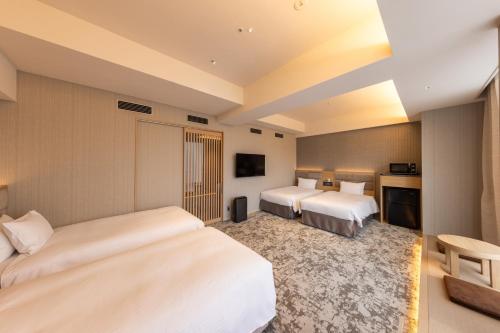 Habitación Deluxe cuádruple - No fumadores (4 camas) del hotel KEIHAN TSUKIJI GINZA GRANDE. Foto 1
