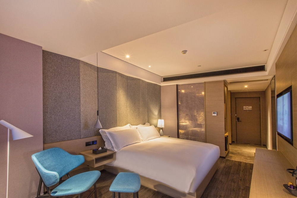 Habitación Deluxe, 1 cama de matrimonio grande del hotel Mercure Suzhou Downtown. Foto 2