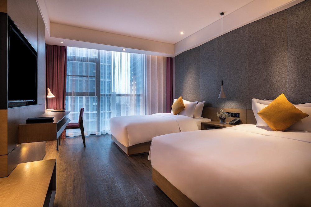 Habitación Deluxe, 2 camas individuales del hotel Mercure Suzhou Downtown. Foto 2