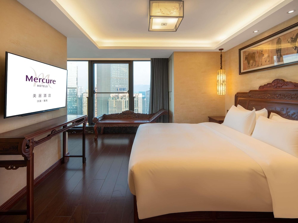 Suite Deluxe, 1 cama de matrimonio grande, vistas a la ciudad del hotel Mercure Chongqing Downtown. Foto 6