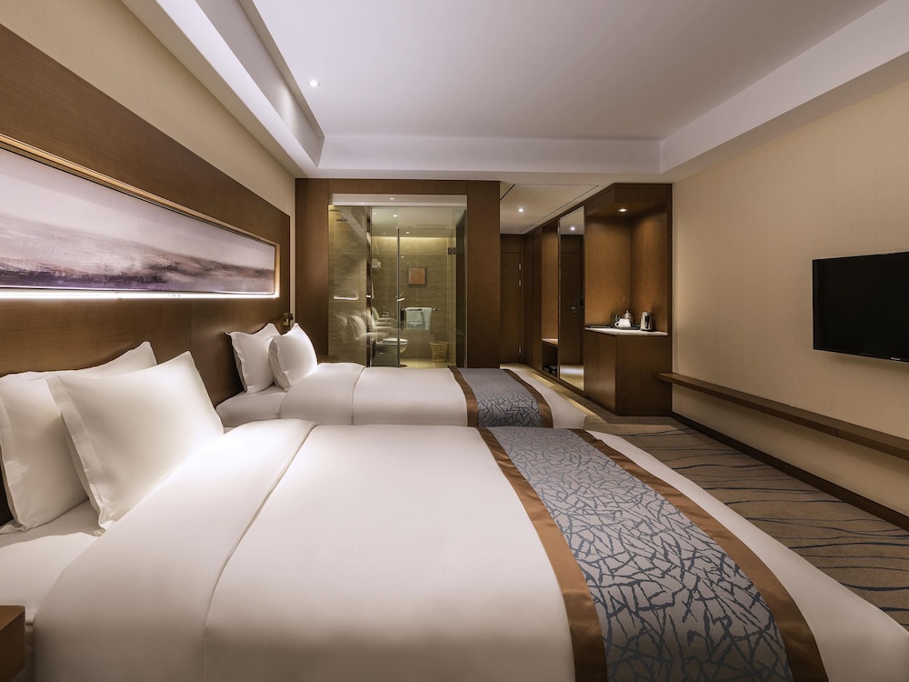 Habitación, 2 camas individuales (Privilege) del hotel Novotel Qingdao New Hope. Foto 2
