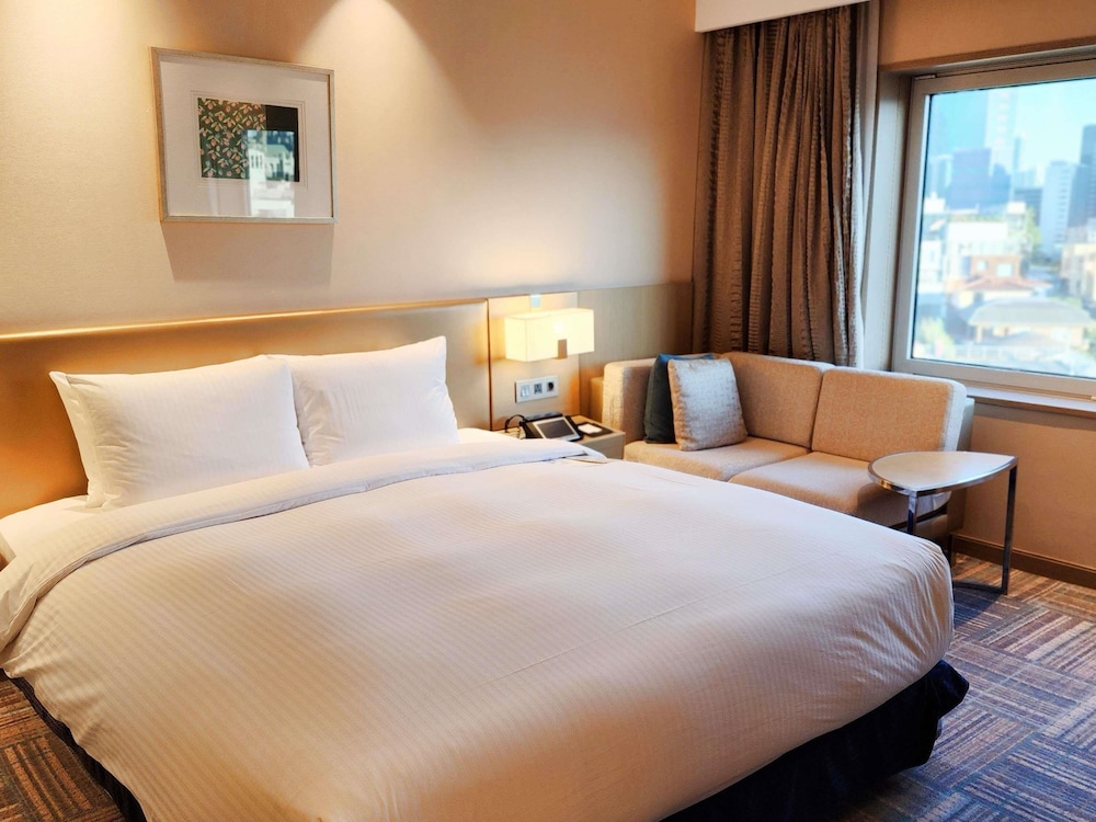 Habitación Deluxe con 1 cama queen del hotel Novotel Ambassador Seoul Gangnam. Foto 6