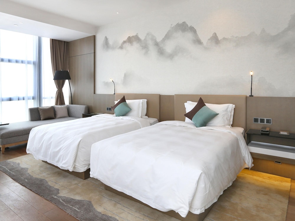 Habitación ejecutiva con 2 camas individuales del hotel Novotel Deqing Moganshan. Foto 4