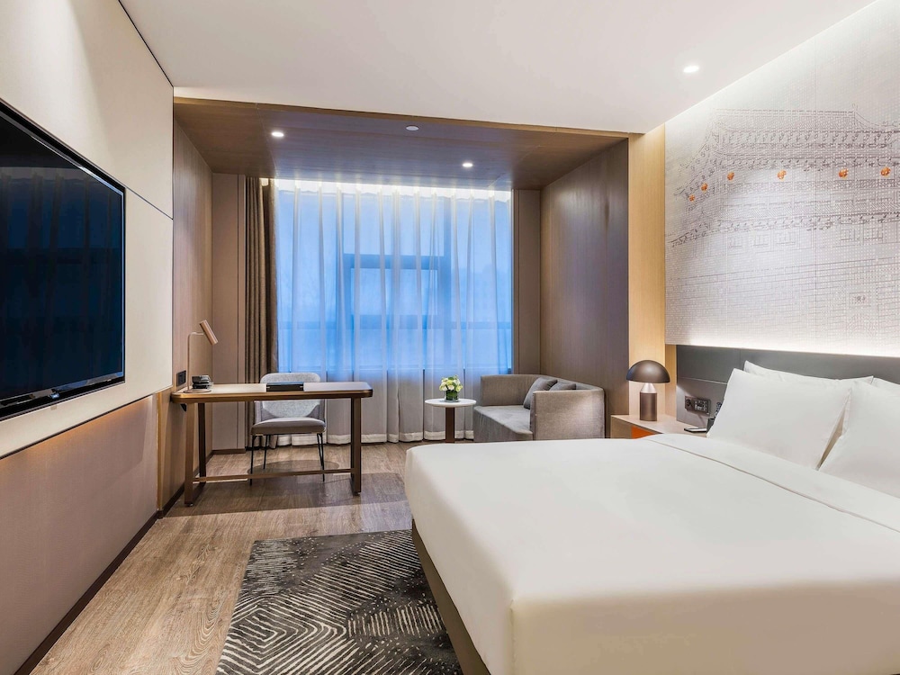 Habitación Deluxe con una cama King size del hotel Novotel Xi'an The Bell Tower