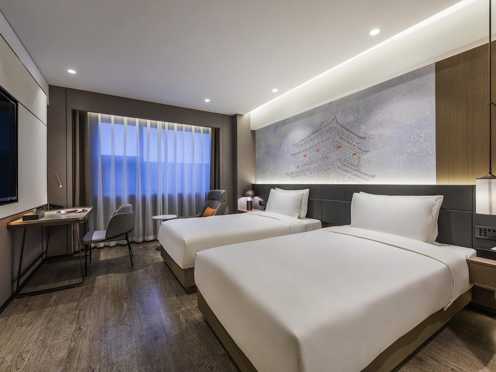 Habitación Deluxe con dos camas individuales del hotel Novotel Xi'an The Bell Tower