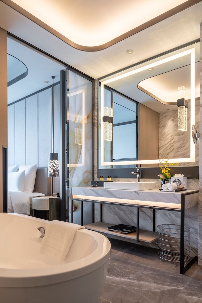 Suite Deluxe, 1 cama de matrimonio grande, Acceso al salón del club del hotel Pullman Suzhou Zhonghui. Foto 3