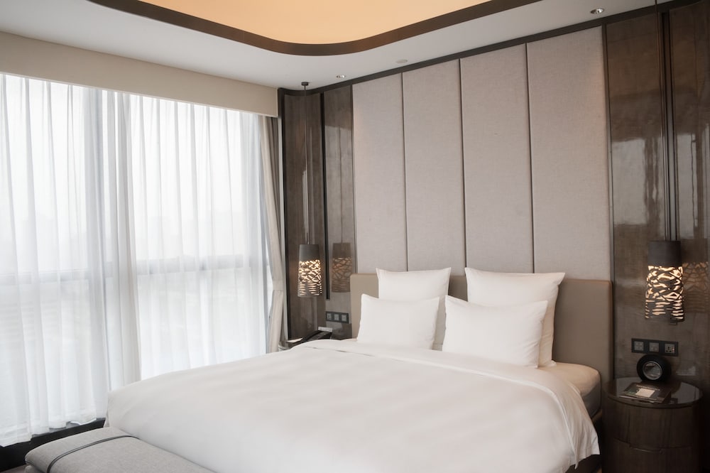 Habitación superior, 1 cama de matrimonio grande del hotel Pullman Suzhou Zhonghui. Foto 4