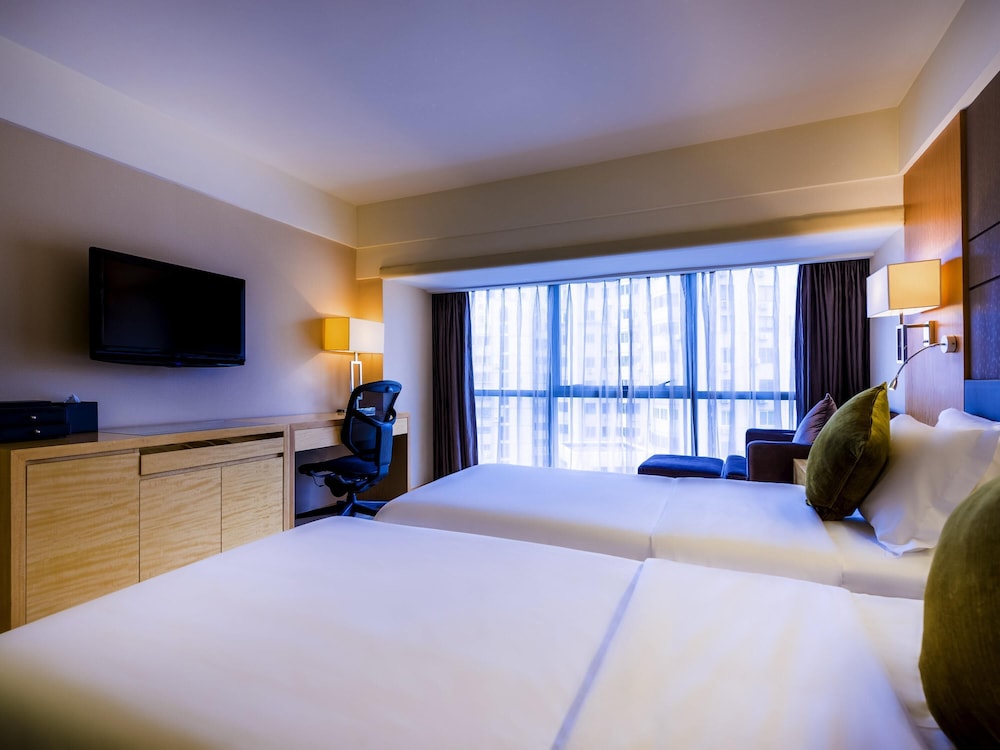 Suite Deluxe con 2 camas individuales del hotel Grand Mercure Xiamen Downtown. Foto 2