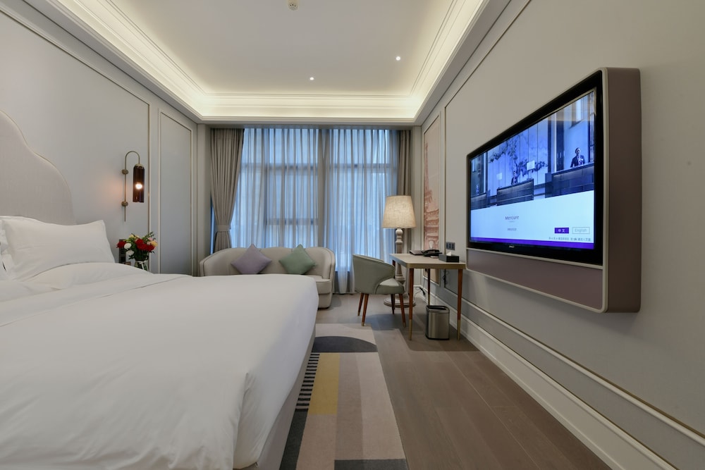 Habitación superior, 1 cama de matrimonio grande del hotel Mercure Taiyuan Jinyang. Foto 4