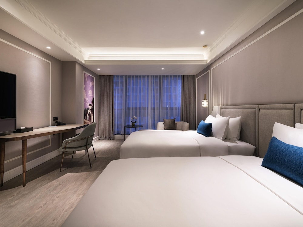 Habitación Deluxe con 2 camas individuales del hotel Mercure Hangzhou Xixi Future Tech City. Foto 3