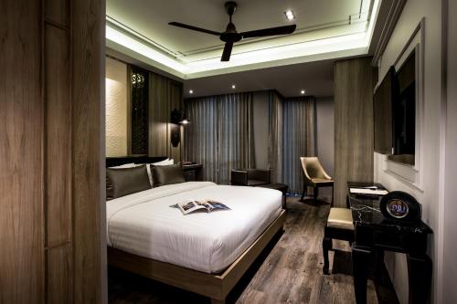Habitación Deluxe del hotel De Chai the Deco Chiang Mai. Foto 10