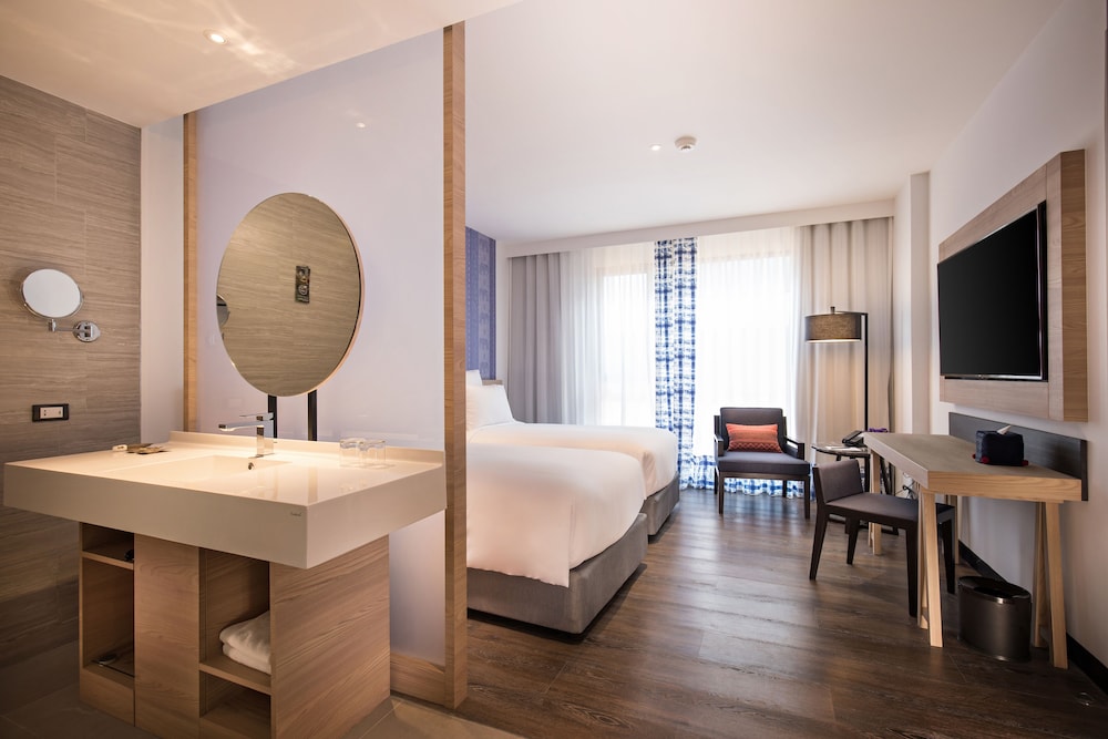 Habitación Deluxe con dos camas individuales del hotel Novotel Chiangmai Nimman Journeyhub. Foto 1