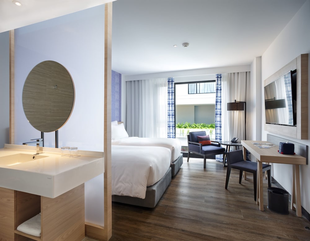 Habitación Deluxe con dos camas individuales del hotel Novotel Chiangmai Nimman Journeyhub. Foto 2