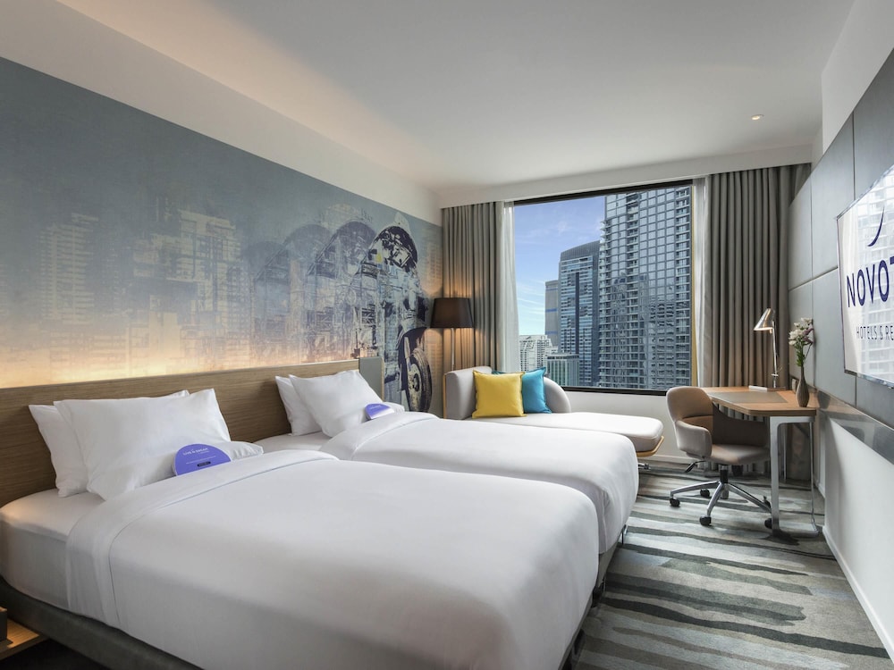 Habitación Deluxe con 2 camas individuales del hotel Novotel Bangkok Sukhumvit 4. Foto 3