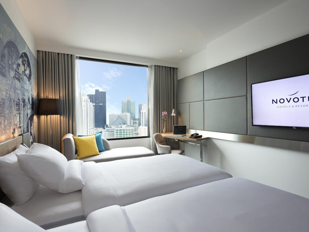 Habitación Deluxe con 2 camas individuales del hotel Novotel Bangkok Sukhumvit 4. Foto 6