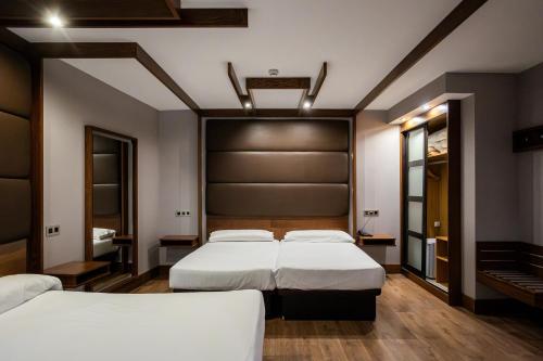 Habitación Cuádruple del hotel Centro Los Braseros. Foto 4